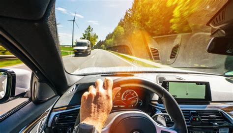 Hands Of Car Driver On Steering Wheel Road Trip Driving On Highway