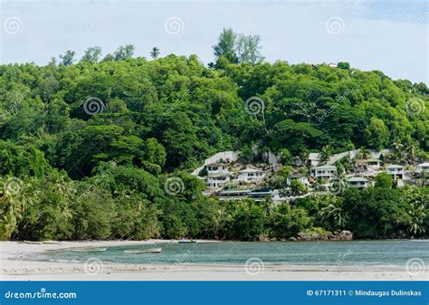 VICTORIA, SEYCHELLES - MAY 15, 2013: Beach in Seychelles with Buildings ...