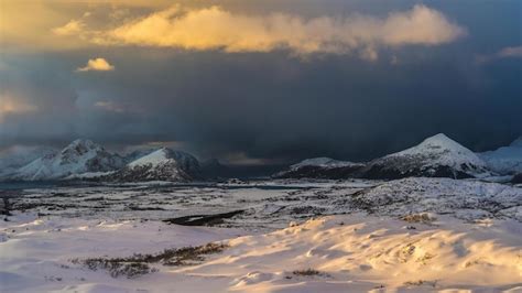 Premium Photo A Snowy Landscape With Mountains In The Background And