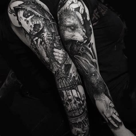 Black And White Tattoos On The Arm Of A Woman With A Bird Cage In Her Hand