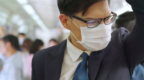 Premium Photo Young Man Wearing Face Mask Travels On Crowded Subway Train