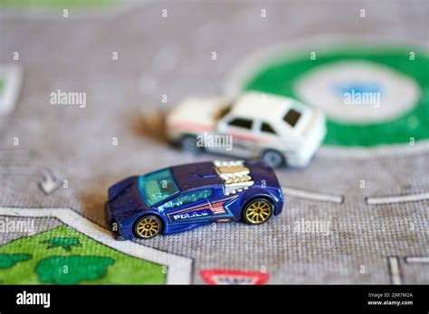 A Mix Of Hot Wheels Toy Model Cars On A Play Road Stock Photo Alamy