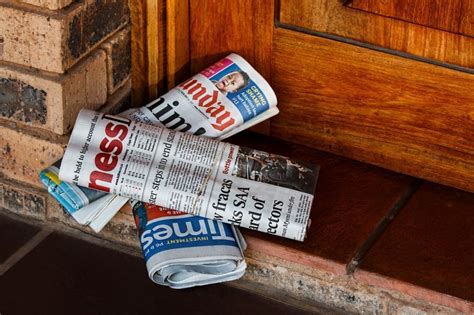 Free Stock Photo Of Newspaper Laying Next To Door Download Free