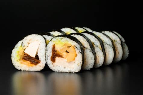 Sushi Rolls With Smoked Eel Avocado Cream Cheese And Unagi Sauce