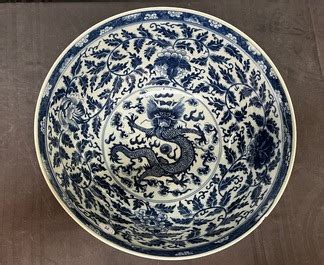 A Large Chinese Blue And White Lotus Scrolls Bowl And Three Famille