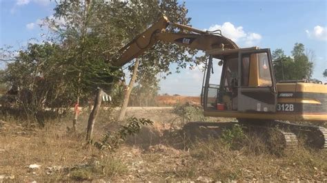 អចCat 312សអតដ Mini Caterpillar excavator land clearing YouTube