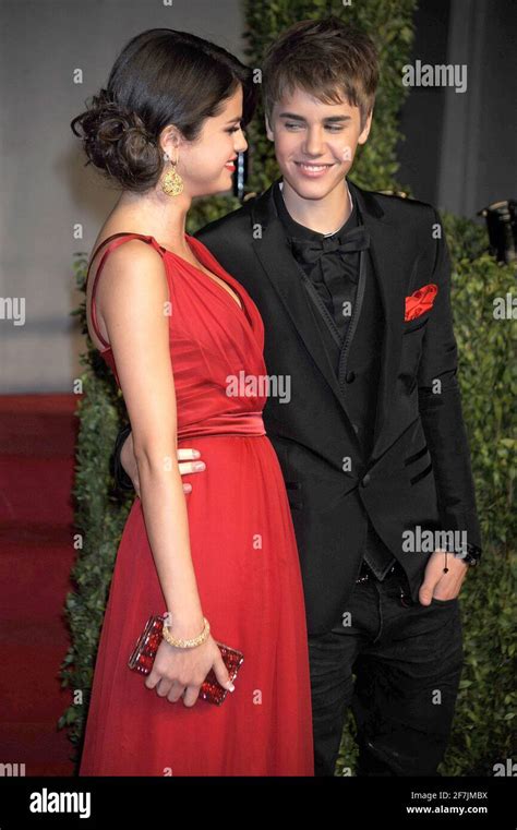 Selena Gomez And Justin Bieber At The 2011 Vanity Fair Oscar Party Hosted By Graydon Carter At