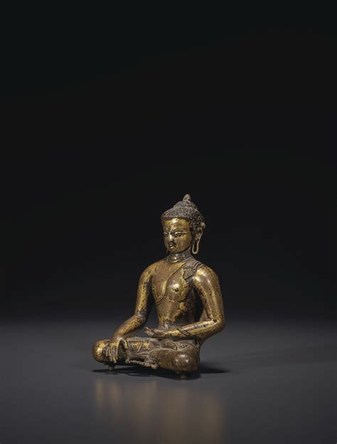 A GILT BRONZE FIGURE OF BUDDHA SHAKYAMUNI NEPAL THAKURI EARLY MALLA