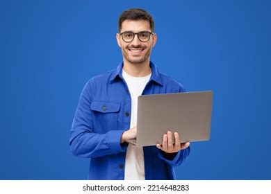 Tech Guy Holding Laptop Standing Royalty-Free Images, Stock Photos ...