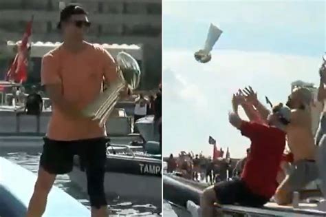 Tom Brady Throws Lombardi Trophy During Super Bowl Boat Parade