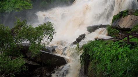 A Strong Current Near A Waterfall Floods Flowing In Mountain Rivers