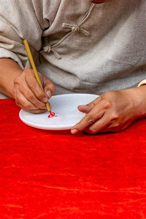 vertical photo  human hand  handwriting  calligraphic brush