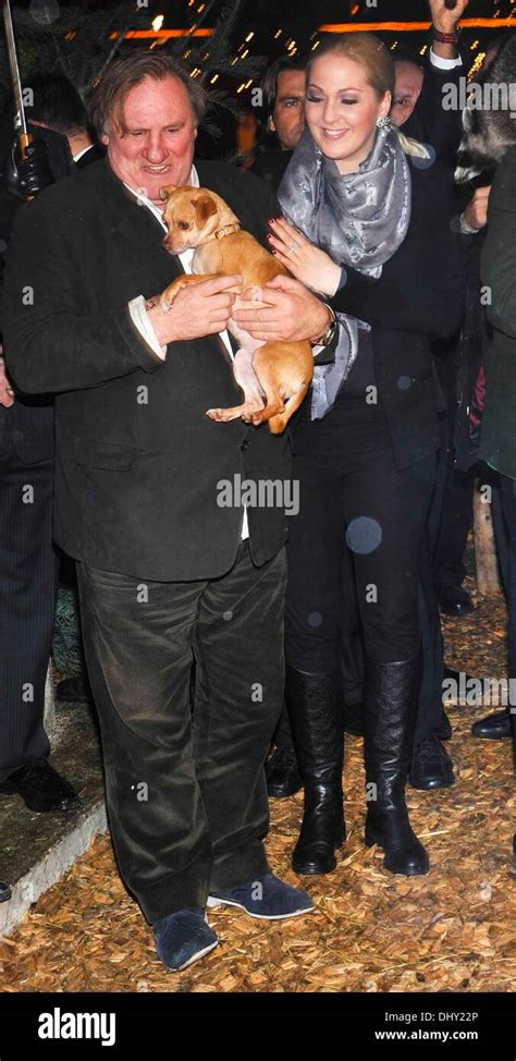 Gerard Depardieu and Kathrin Glock, wife of manufacturer Gaston Glock "Glock" pistols pose with ...