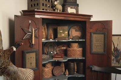 A Wooden Cabinet Filled With Lots Of Items