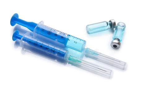 Disposable Syringes With Needles And Vials On White Background Stock