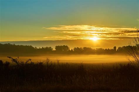 Premium Photo Golden Sunrise Over Misty Countryside Landscape