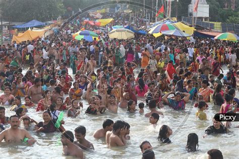 Image Of Hindu Devotees Or Pilgrims Taking Holy Bath In Triveni Sangam