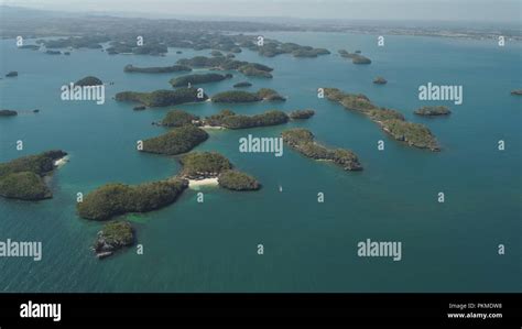 Aerial view of Small islands with beaches and lagoons in Hundred Islands National Park ...