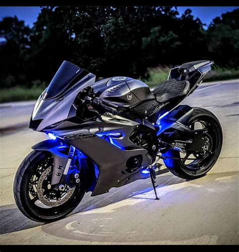 A Black And Blue Motorcycle Parked On The Street