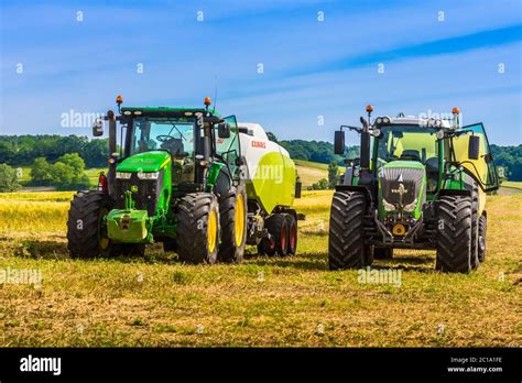 John Deere R And Fendt Tractors On Farmland France Stock