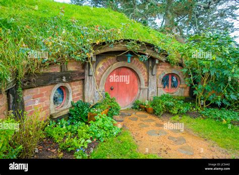 NORTH ISLAND, NEW ZEALAND- MAY 16, 2017: Hobbit house with red door ...