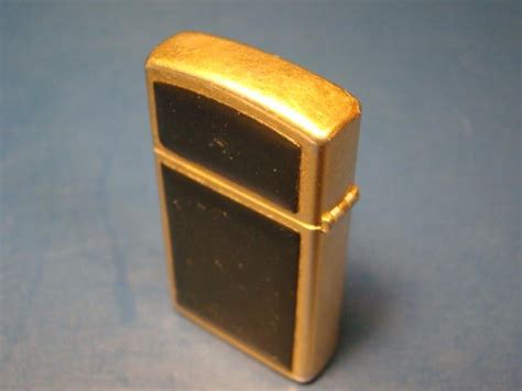 Zippo Cigarette Lighter Slimline Vintage Black Brass Gold Color