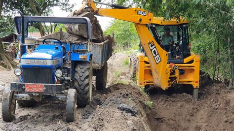 Jcb Backhoe Machine Making Drain And Loading Soil In Tractor Jcb