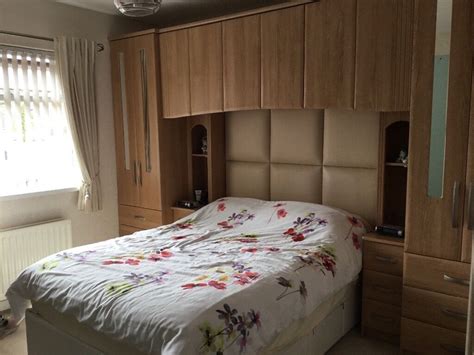 Fitted over bed wardrobe unit including leather headboard | in Comber ...