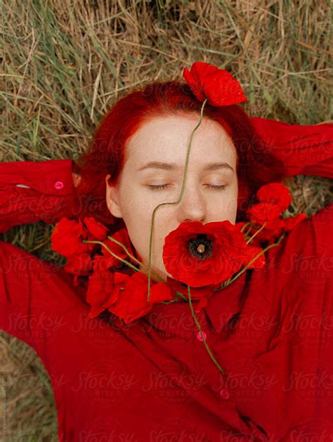 Female Portrait With Poppy Flower By Stocksy Contributor Liza