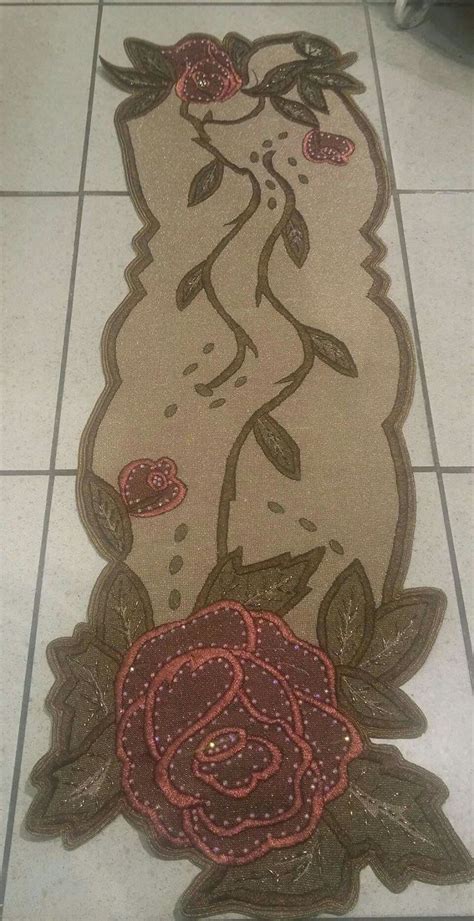 A Rug With An Image Of A Rose On It