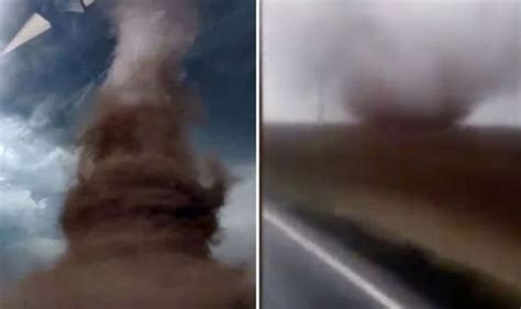 Watch moment a bus is swept 30 FEET into the air by a giant tornado ...