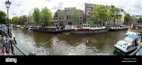 Amsterdam canal boat Stock Photo - Alamy