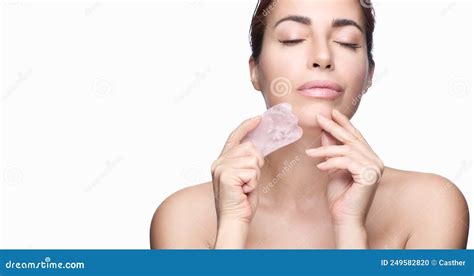 Beautiful Woman With Glowing Healthy Skin And Massage Gua Sha Tool