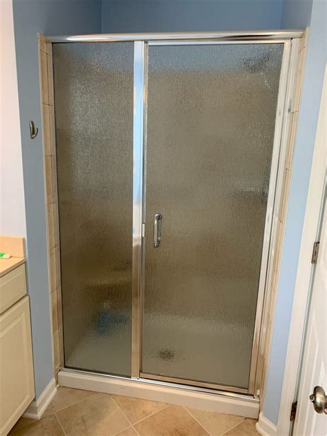 Frameless Shower Enclosure Door Hinged To Panel And Side Panel Notched