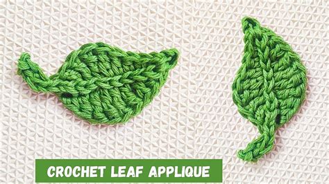 the crochet leaf applique is made from green yarn