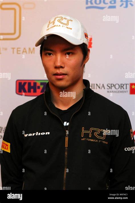 Chinese F Driver Ma Qinghua Poses At A Press Conference Of Hrt In