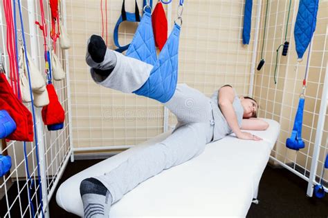 Young Woman Patient Doing Physical Exercises In A Rehabilitation Study