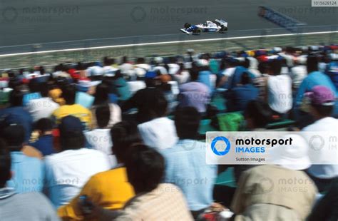 The Large Japanese Crowd Watch Damon Hill In The Williams Pacific