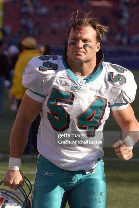 Zach Thomas of the Miami Dolphins looks on during a football game ...