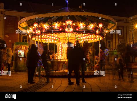 View Of A Spinning Carousel For Kids Night Scene Long Exposure Stock