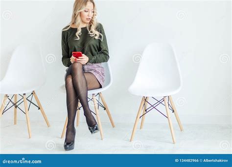 Smiling Blonde Woman Sitting On Office Chair Young Assistant At The