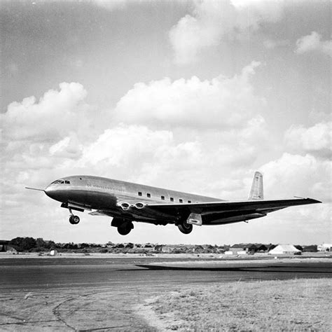 black and white photograph of an airplane taking off from the runway ...