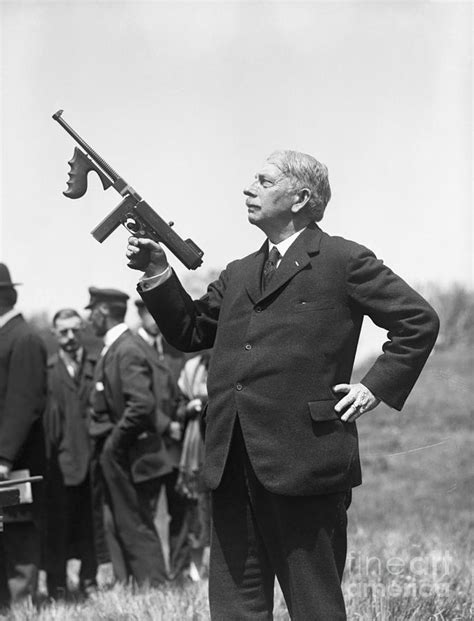 John Thompson Holding Machine Gun By Bettmann