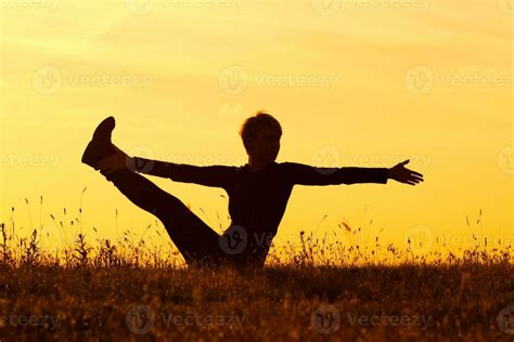 Silhouette of woman doing yoga 34824307 Stock Photo at Vecteezy