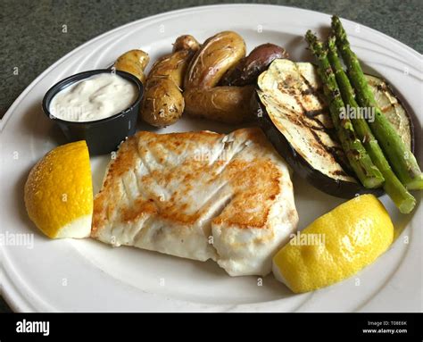 Baked Fish With Vegetables Stock Photo Alamy