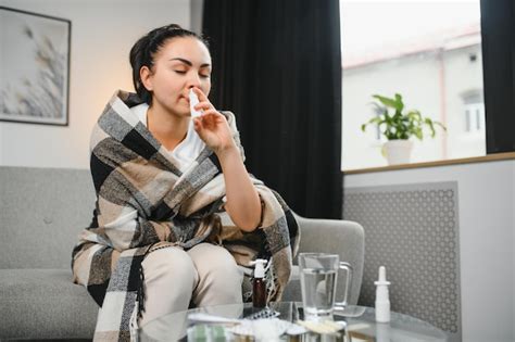 Premium Photo Ill Woman Using Nasal Spray At Home