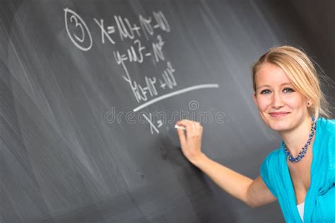 Pretty Young College Student Or Teacher Washing The Chalkboardblackboa