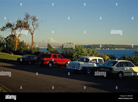 Cars And People At Magnolia Bluff Park Viewpoint Overlooks Puget Sound