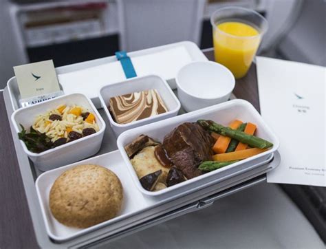 Airlines Are Bringing Back Inflight Snacks And Drinks But Should You