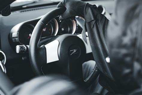A car dashboard with a steering wheel and dashboard controls photo